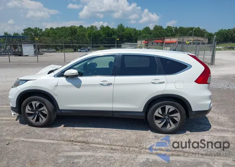 2016 Honda Cr-V Touring z USA, uszkodzony, nr VIN 5J6RM4H95GL118070